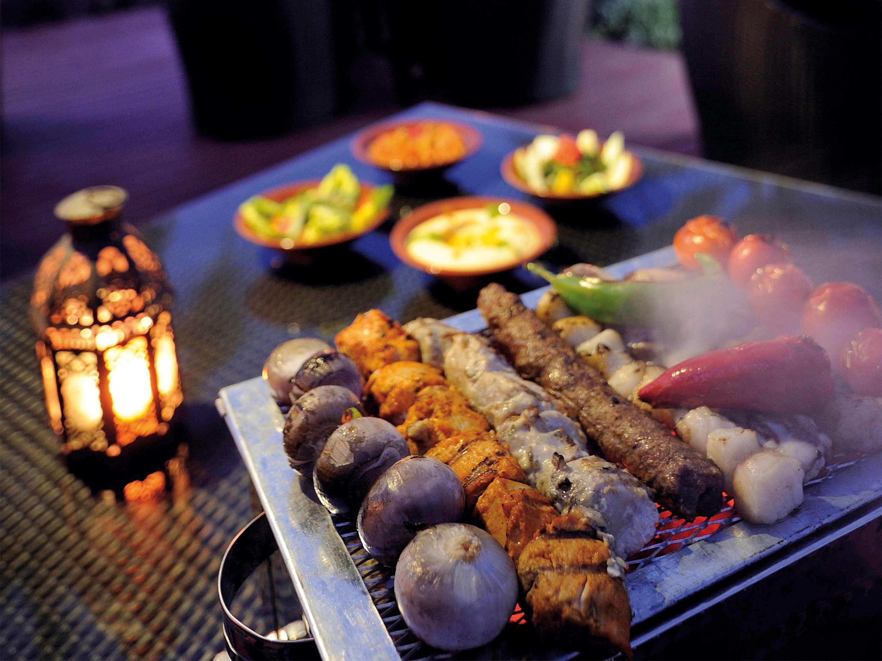 Mövenpick Hotel&Resort Al Bida'a Salmiya Kültér fotó A selection of kebabs